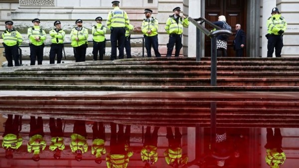 Extinction Rebellion protesters use fire engine to spray Treasury with fake blood
Extinction Rebellion protesters use fire engine to spray Treasury with fake blood